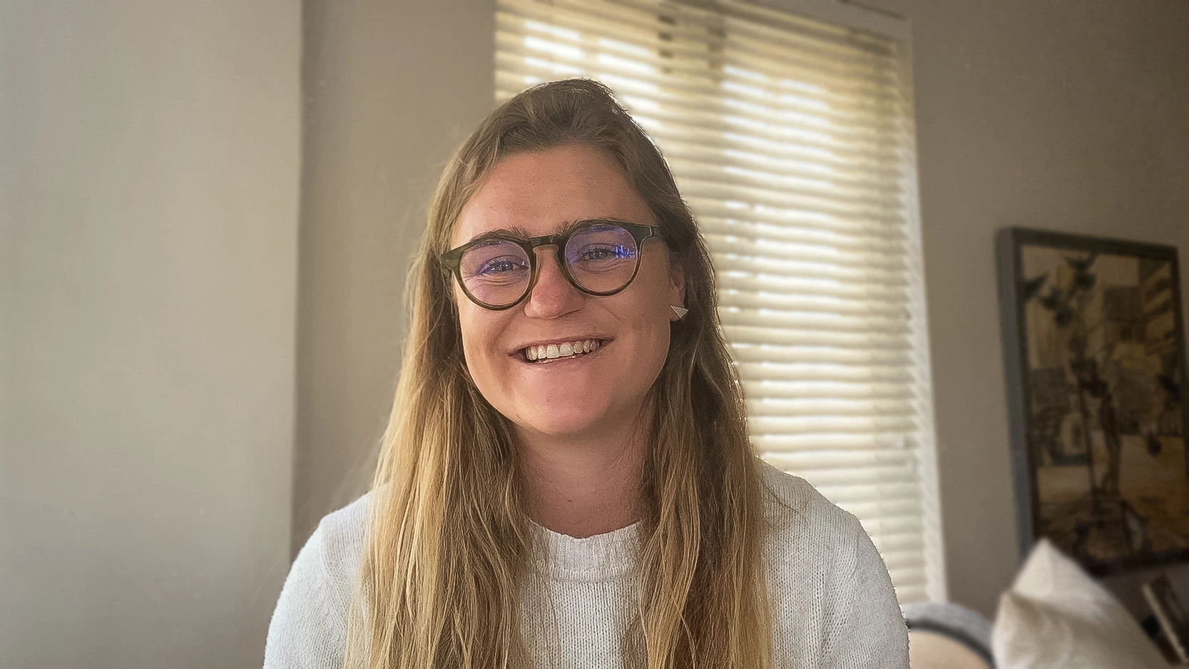 Video still of Stephanie Polkinghorne, data scientist at ProQuo AI, smiling at the camera